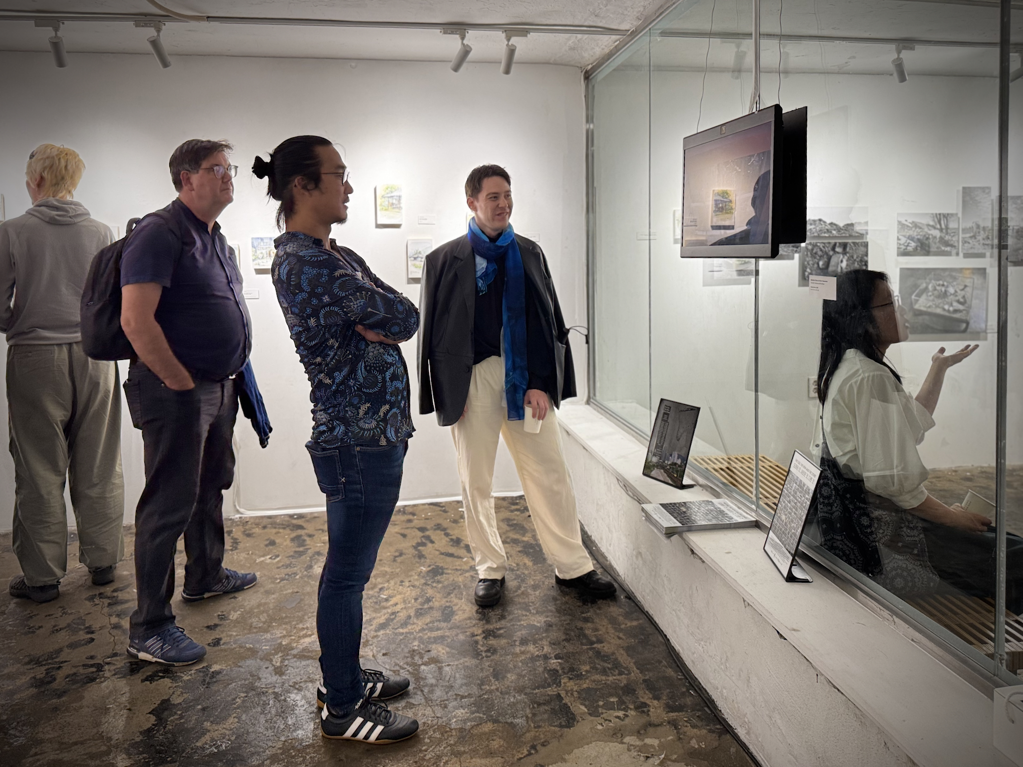 Visitors viewing the Sony spatial display in the gallery